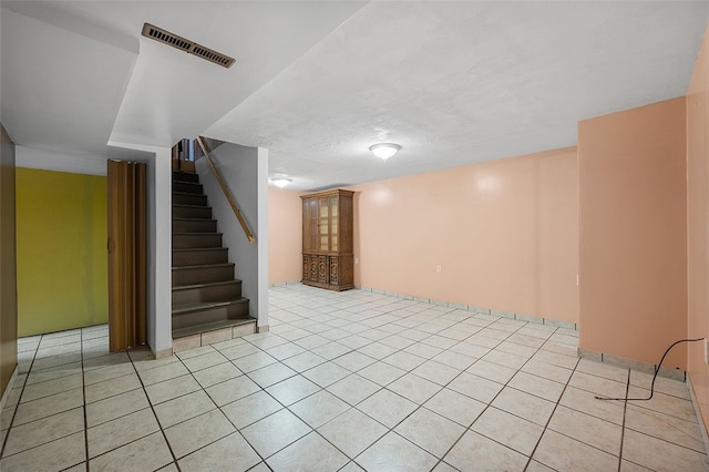 115 Shippingport Rd, Aliquippa, PA 15001 - finished below grade area with stairway and light tile patterned floors