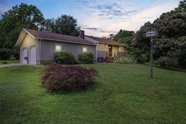 115 Shippingport Rd, Aliquippa, PA 15001 - property exterior at dusk featuring a chimney, a lawn, and a garage