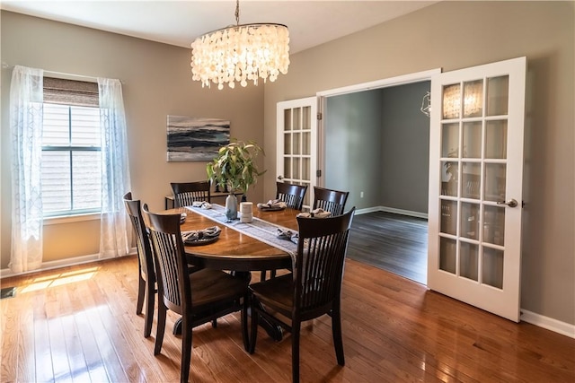 106 Kestler Dr, Pine Twp, PA 15090 - dining area with a chandelier, wood finished floors, and french doors