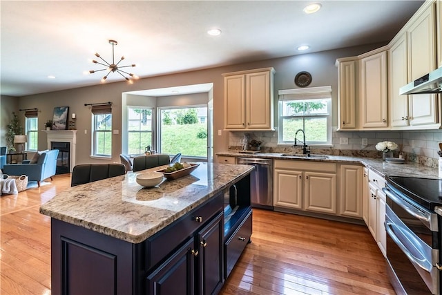 106 Kestler Dr, Pine Twp, PA 15090 - kitchen featuring stainless steel appliances, open floor plan, backsplash, recessed lighting, and light wood-type flooring