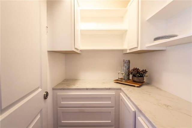 106 Kestler Dr, Pine Twp, PA 15090 - kitchen featuring open shelves, white cabinetry, and light stone countertops