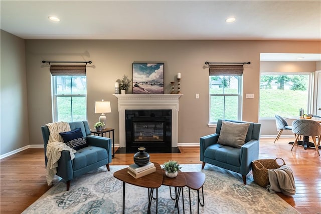 106 Kestler Dr, Pine Twp, PA 15090 - living area with wood finished floors, healthy amount of natural light, recessed lighting, and a fireplace with flush hearth