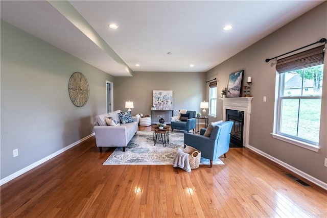106 Kestler Dr, Pine Twp, PA 15090 - living room featuring hardwood / wood-style flooring, a glass covered fireplace, and recessed lighting