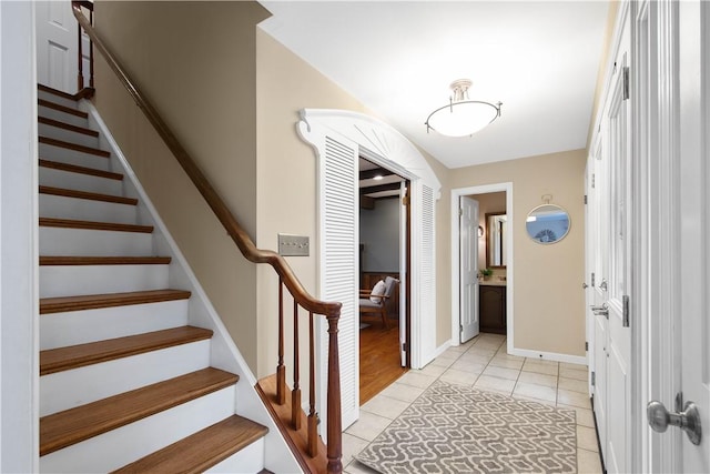 1742 Partridge Run Rd, Saint Clair, PA 15241 - entrance foyer with light tile patterned flooring and stairway