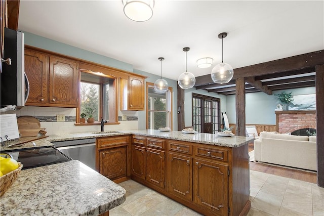 1742 Partridge Run Rd, Saint Clair, PA 15241 - kitchen with appliances with stainless steel finishes, a peninsula, beamed ceiling, decorative light fixtures, and brown cabinets