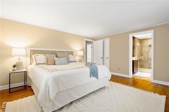 1742 Partridge Run Rd, Saint Clair, PA 15241 - bedroom with wood finished floors, ornamental molding, ensuite bath, and a closet