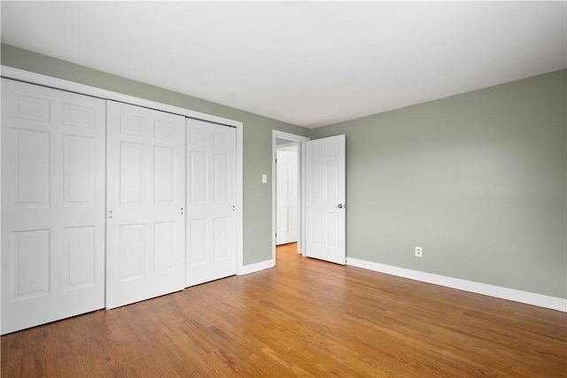 1742 Partridge Run Rd, Saint Clair, PA 15241 - unfurnished bedroom featuring light wood finished floors and a closet