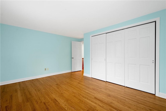 1742 Partridge Run Rd, Saint Clair, PA 15241 - unfurnished bedroom featuring wood finished floors and a closet