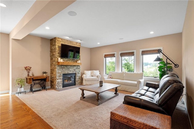 207 Tamarack Dr, Adams Twp, PA 16046 - living room featuring recessed lighting, a stone fireplace, and wood finished floors