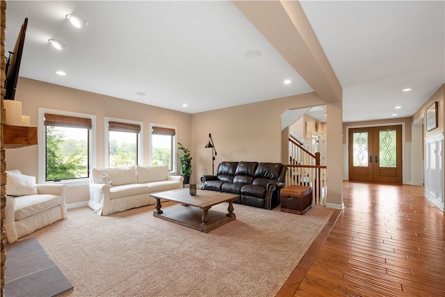 207 Tamarack Dr, Adams Twp, PA 16046 - living room featuring stairs, hardwood / wood-style flooring, recessed lighting, and arched walkways