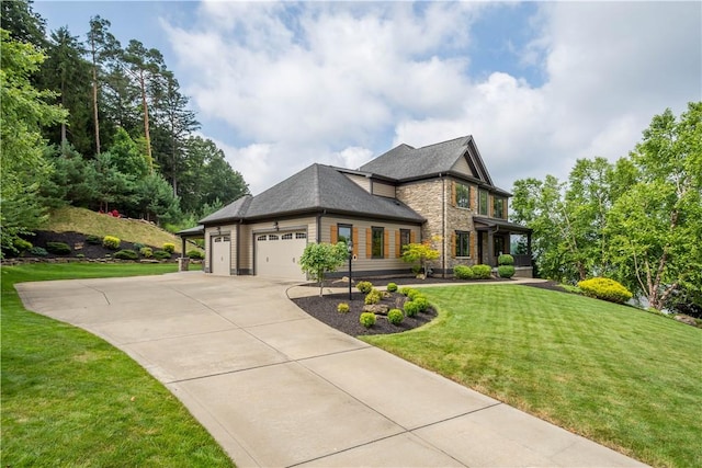 207 Tamarack Dr, Adams Twp, PA 16046 - view of front of house with stone siding, driveway, an attached garage, and a front lawn