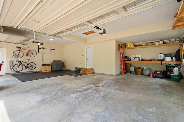 207 Tamarack Dr, Adams Twp, PA 16046 - garage featuring a garage door opener