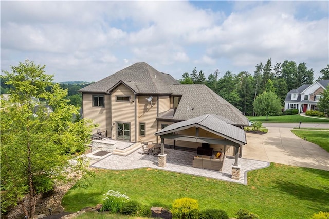 207 Tamarack Dr, Adams Twp, PA 16046 - rear view of house with a patio, a yard, an outdoor living space, and roof with shingles