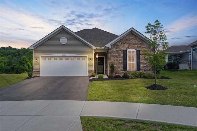 2034 Aiken Ct, Robinson Twp, PA 15136 - ranch-style home with stone siding, asphalt driveway, a front lawn, and a garage