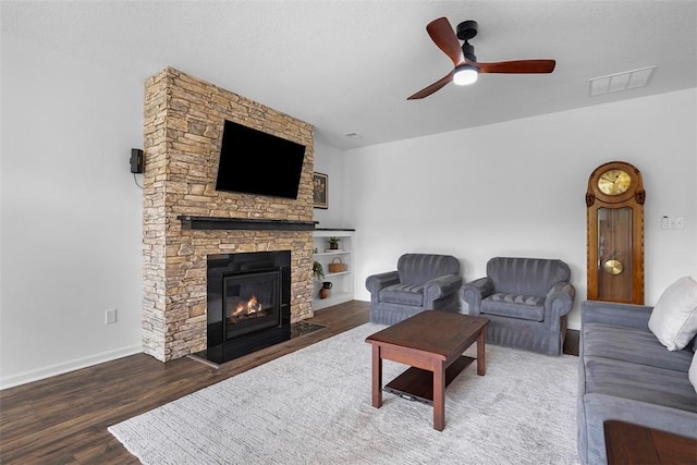 2034 Aiken Ct, Robinson Twp, PA 15136 - living room with wood finished floors, a ceiling fan, and a stone fireplace