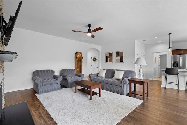2034 Aiken Ct, Robinson Twp, PA 15136 - living area featuring arched walkways, a ceiling fan, dark wood-style floors, and recessed lighting