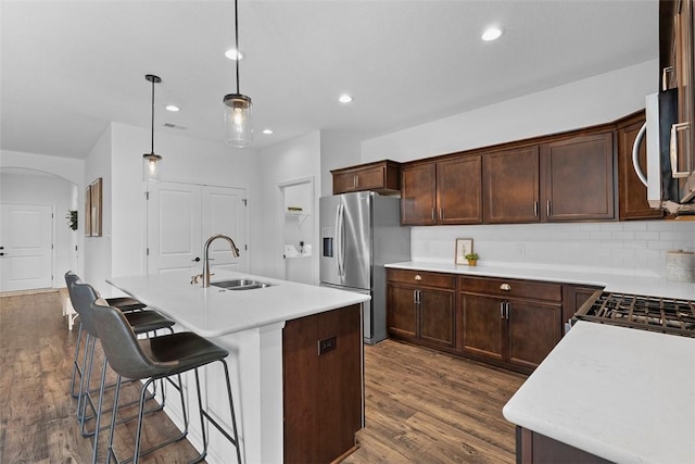 2034 Aiken Ct, Robinson Twp, PA 15136 - kitchen with stainless steel appliances, dark wood-type flooring, light countertops, recessed lighting, and a center island with sink