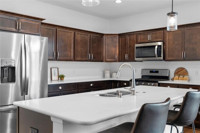 2034 Aiken Ct, Robinson Twp, PA 15136 - kitchen with appliances with stainless steel finishes, hanging light fixtures, light countertops, dark brown cabinetry, and recessed lighting