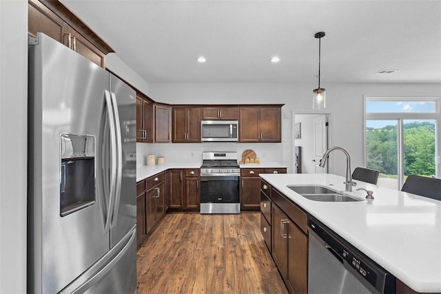 2034 Aiken Ct, Robinson Twp, PA 15136 - kitchen with stainless steel appliances, dark wood finished floors, light countertops, recessed lighting, and dark brown cabinets