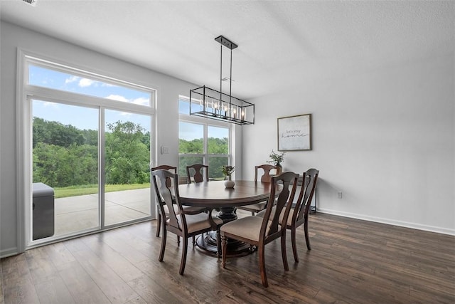 2034 Aiken Ct, Robinson Twp, PA 15136 - dining room featuring dark wood-style floors, healthy amount of natural light, a chandelier, and a textured ceiling