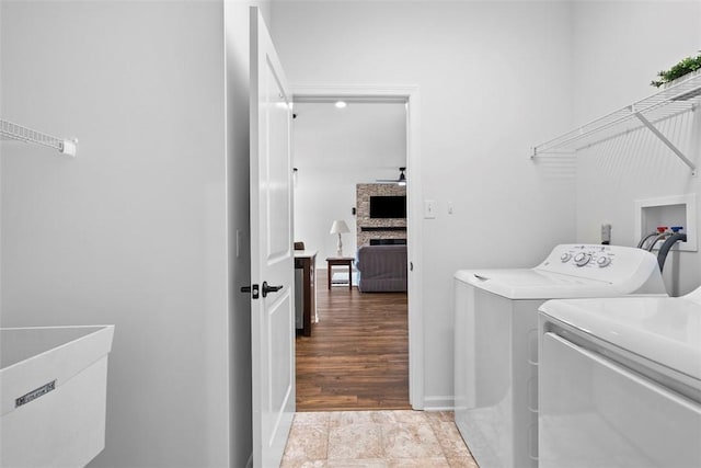 2034 Aiken Ct, Robinson Twp, PA 15136 - laundry room with washing machine and clothes dryer and a large fireplace
