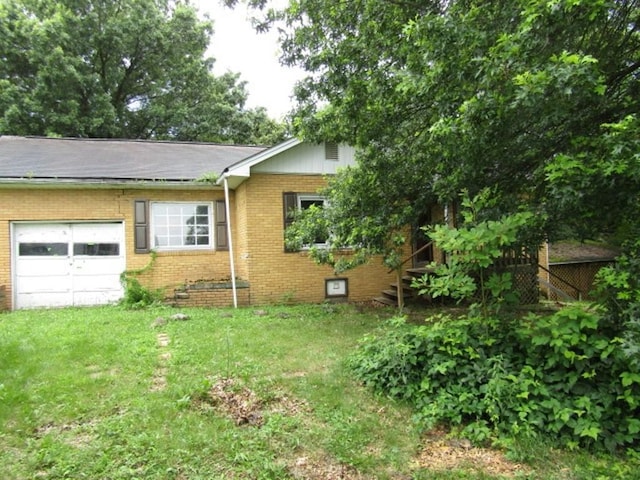 463 Georgetown Rd, South Beaver Twp, PA 16115 - view of front of home with an attached garage, brick siding, and a front lawn