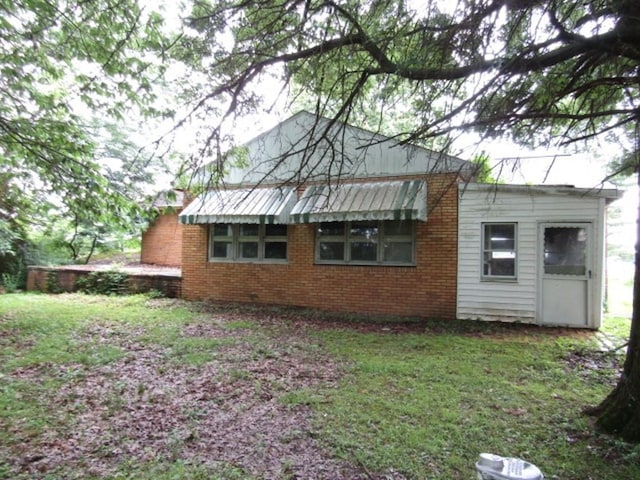 463 Georgetown Rd, South Beaver Twp, PA 16115 - view of side of property with brick siding and a yard