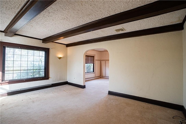 109 Maplewood Ave, Center Twp, PA 15001 - spare room with light colored carpet, arched walkways, beamed ceiling, baseboard heating, and a textured ceiling
