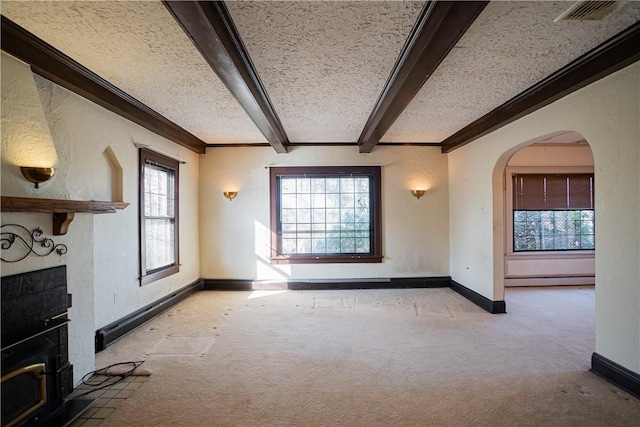 109 Maplewood Ave, Center Twp, PA 15001 - unfurnished living room with a large fireplace, carpet, arched walkways, beam ceiling, and crown molding