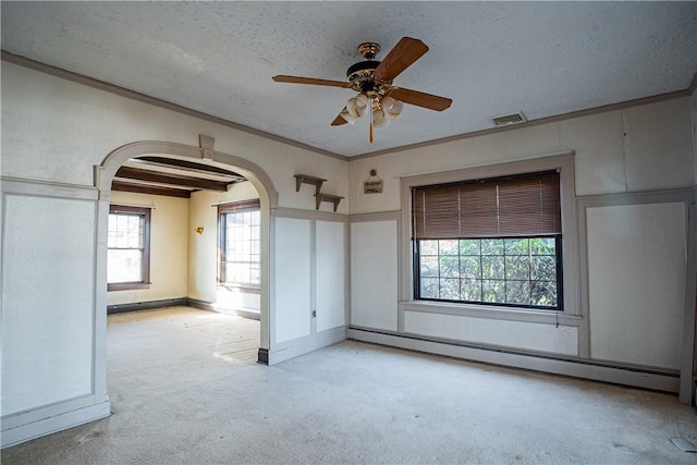 109 Maplewood Ave, Center Twp, PA 15001 - empty room featuring arched walkways, baseboard heating, light carpet, ornamental molding, and ceiling fan
