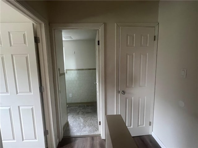 1735 Kimball Ave, New Kensington, PA 15068 - corridor featuring tile walls, a wainscoted wall, and dark wood-style flooring