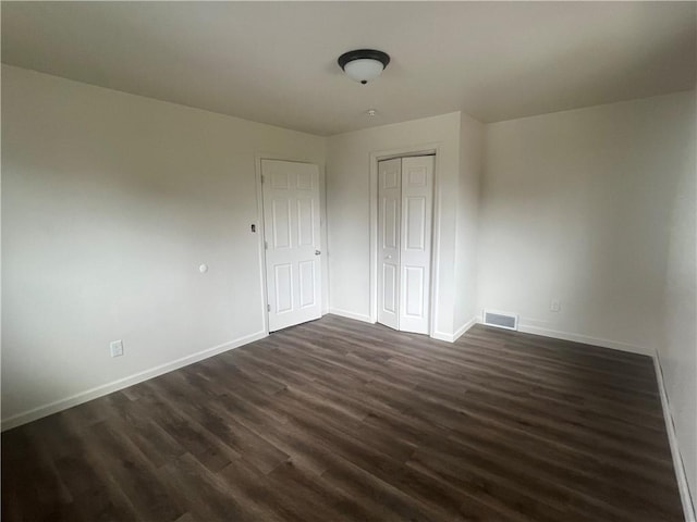 1735 Kimball Ave, New Kensington, PA 15068 - unfurnished bedroom with dark wood-type flooring and a closet