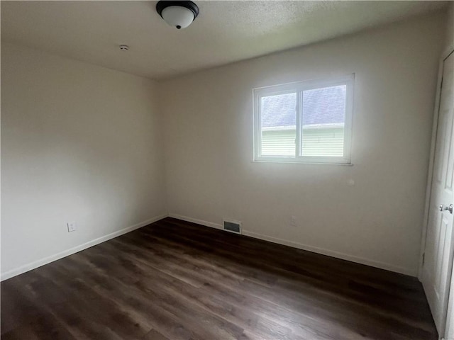 1735 Kimball Ave, New Kensington, PA 15068 - unfurnished room featuring dark wood-type flooring and baseboards
