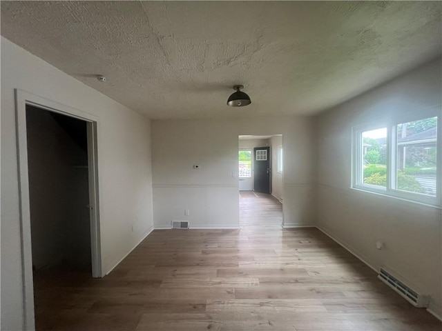1735 Kimball Ave, New Kensington, PA 15068 - hall featuring light wood-type flooring and a textured ceiling