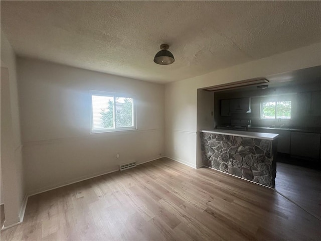 1735 Kimball Ave, New Kensington, PA 15068 - spare room featuring a textured ceiling and wood finished floors