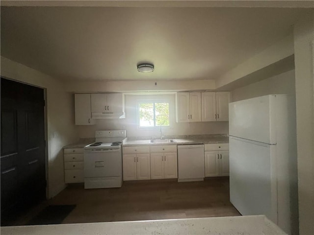 1735 Kimball Ave, New Kensington, PA 15068 - kitchen featuring white appliances, white cabinetry, under cabinet range hood, wood finished floors, and light countertops
