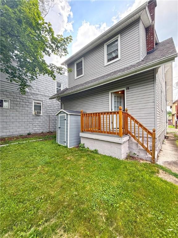 514 Linden Ave, New Kensington, PA 15068 - back of property featuring a storage unit, a chimney, and a yard