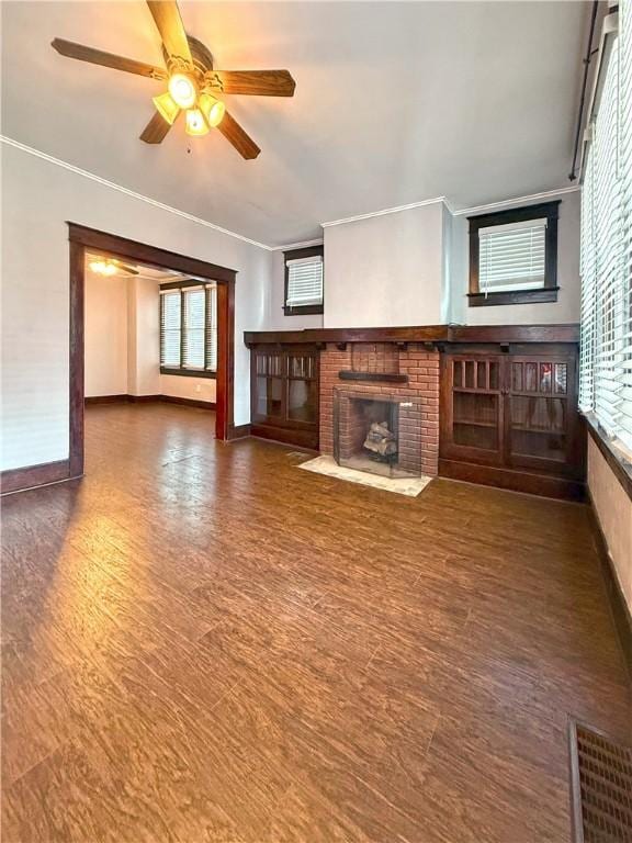 514 Linden Ave, New Kensington, PA 15068 - unfurnished living room with a fireplace, healthy amount of natural light, wood finished floors, ceiling fan, and ornamental molding