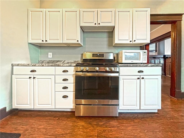 514 Linden Ave, New Kensington, PA 15068 - kitchen with stainless steel gas range, white microwave, and white cabinetry