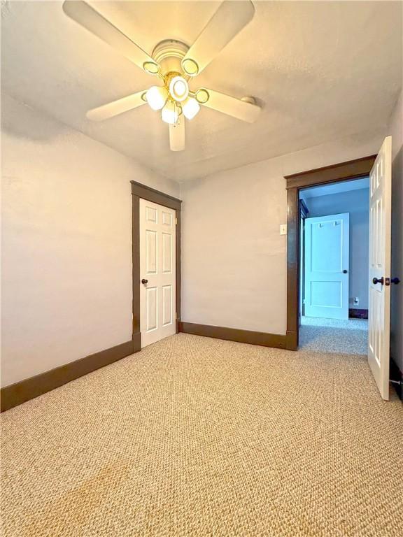 514 Linden Ave, New Kensington, PA 15068 - unfurnished room with light colored carpet and a ceiling fan