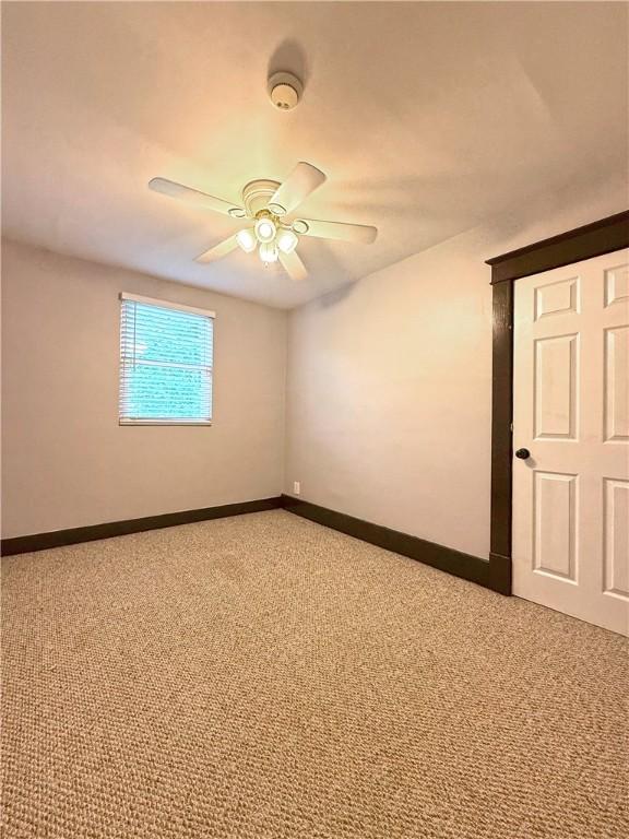 514 Linden Ave, New Kensington, PA 15068 - empty room with light carpet, a ceiling fan, and a smoke detector