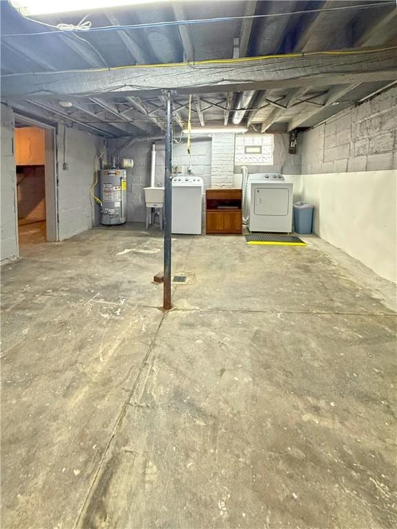 514 Linden Ave, New Kensington, PA 15068 - basement featuring water heater and washing machine and clothes dryer