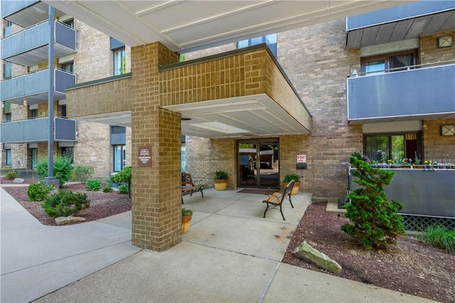 820 E Beau St Unit 6J, South Strabane, PA 15301 - view of exterior entry featuring brick siding