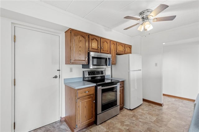 820 E Beau St Unit 6J, South Strabane, PA 15301 - kitchen featuring stainless steel appliances, brown cabinetry, light countertops, and ceiling fan