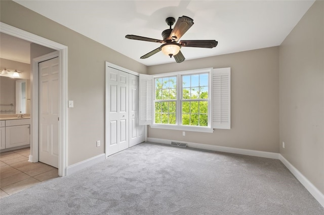 801 Huron Ct, Adams Twp, PA 15044 - unfurnished bedroom featuring light colored carpet, a closet, ceiling fan, and connected bathroom