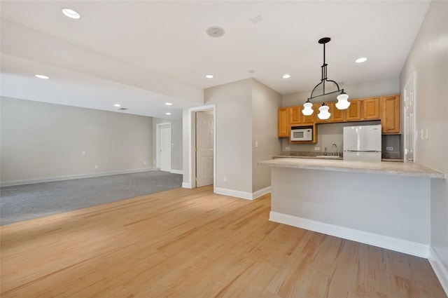 801 Huron Ct, Adams Twp, PA 15044 - kitchen with white appliances, light countertops, hanging light fixtures, recessed lighting, and light wood-style floors