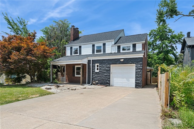 327 Charles Ave, New Kensington, PA 15068 - traditional-style home featuring a porch, driveway, a chimney, an attached garage, and roof with shingles
