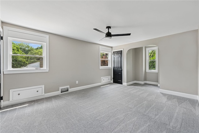 327 Charles Ave, New Kensington, PA 15068 - unfurnished bedroom with carpet flooring, arched walkways, and a ceiling fan