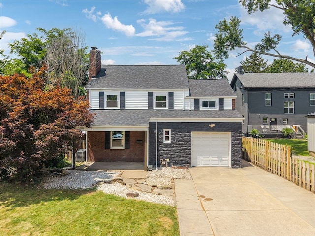 327 Charles Ave, New Kensington, PA 15068 - traditional-style house featuring a chimney, driveway, a porch, and a shingled roof