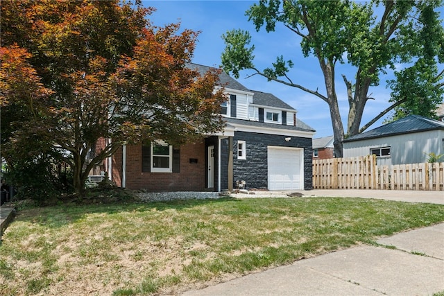 327 Charles Ave, New Kensington, PA 15068 - view of front of property with an attached garage, concrete driveway, and stone siding